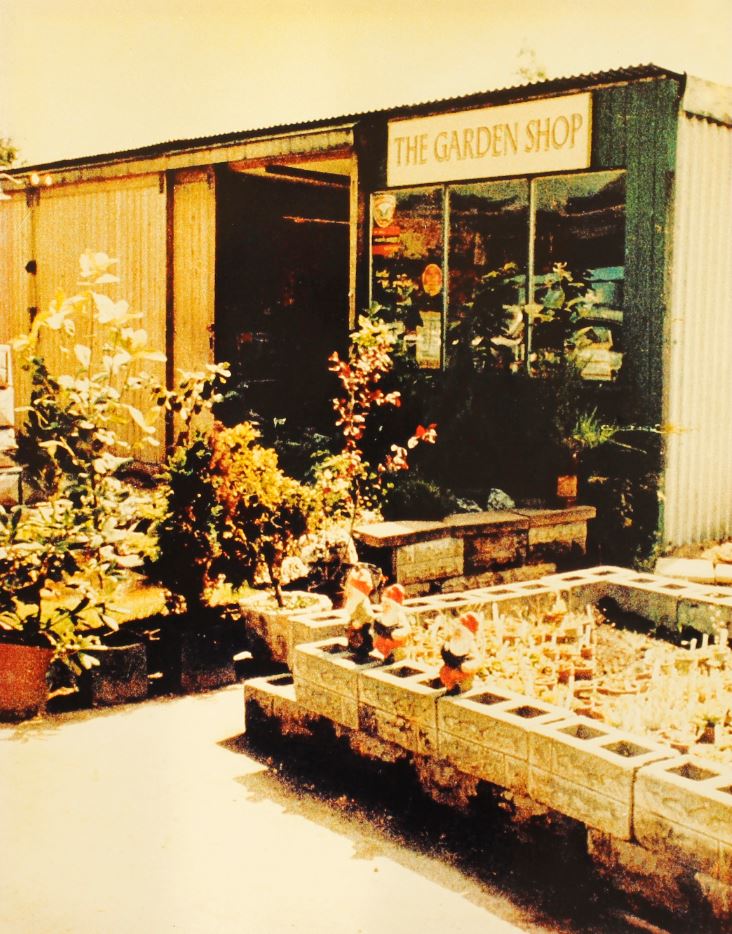 Historial image of the Garden centre with the signage 'The Garden Shop,'