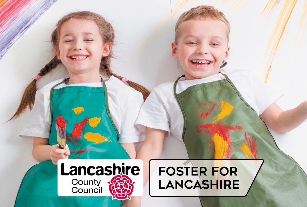Image of two children smiling with aprons covered in paint with Lancashire County Council logo and 'Foster for Lancashire'.