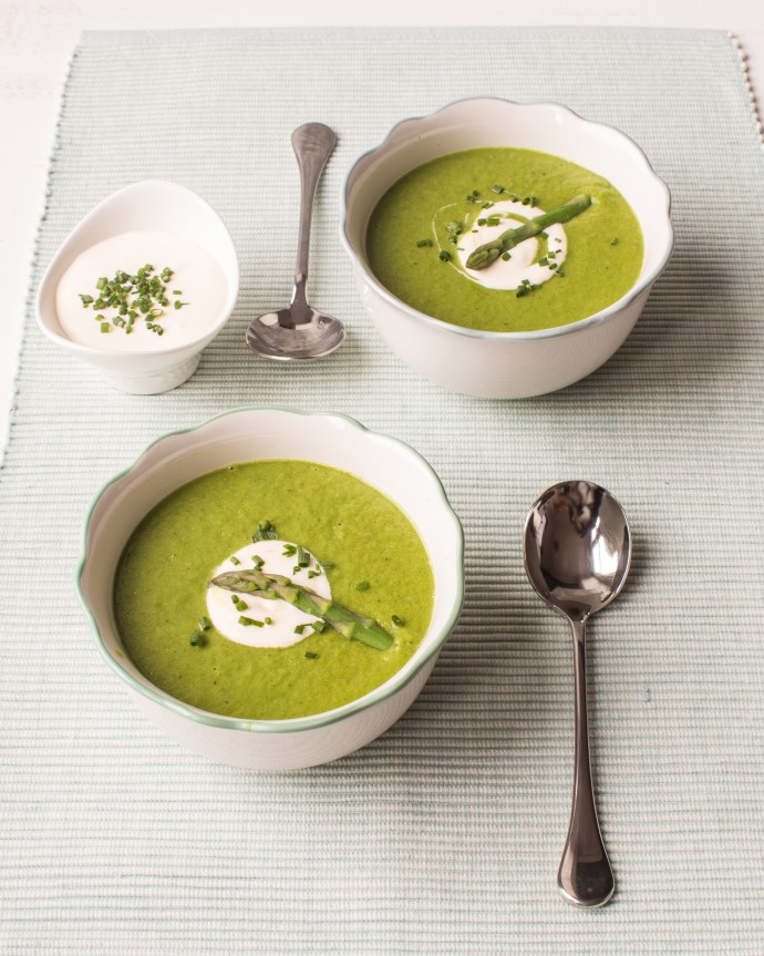 Image of two bowls of asparagus soup.