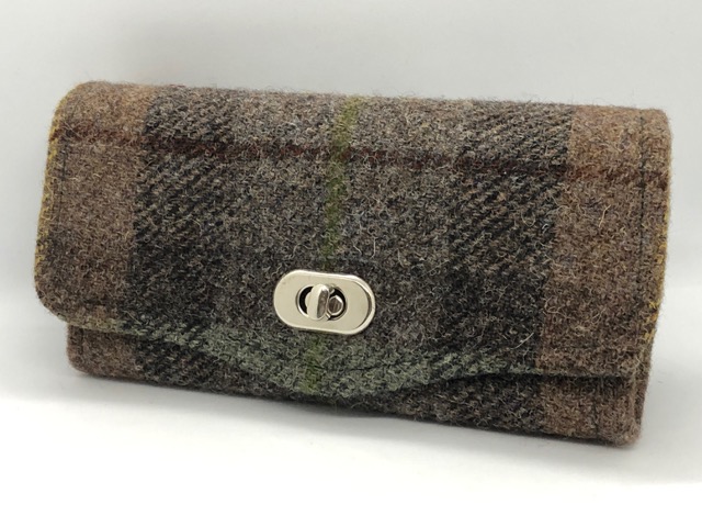 chequed brown and grey woolen clutch bag.