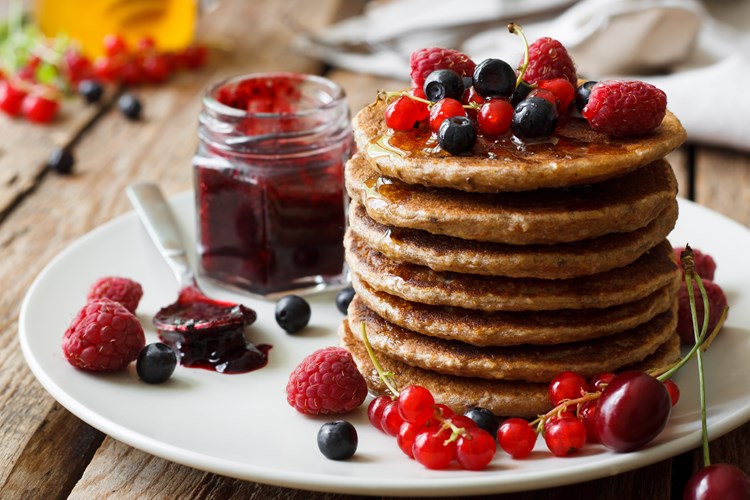 Image of pancakes with jam and berries.