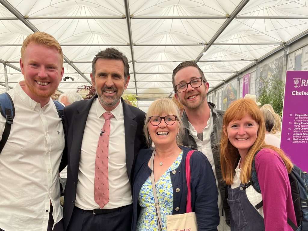 Group photo of staff members Will, Jackie, Jason and Vicky at the Chelsea Flower Show, pictured with Adam Frost (British garden designer and presenter on the BBC's Gardeners' World).