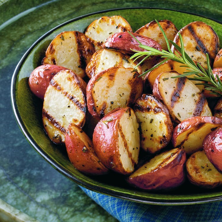 Close up image of barbecue grilled new potatoes in a bowl