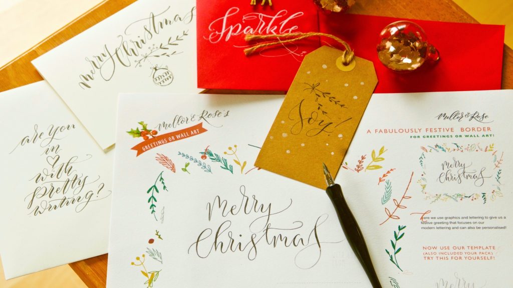 Image of hand written calligraphy on Christmas themes tags and cards